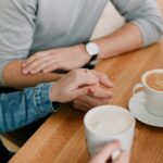 A couple talking over a cup of coffee