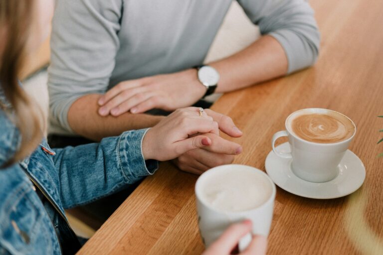 A couple talking over a cup of coffee
